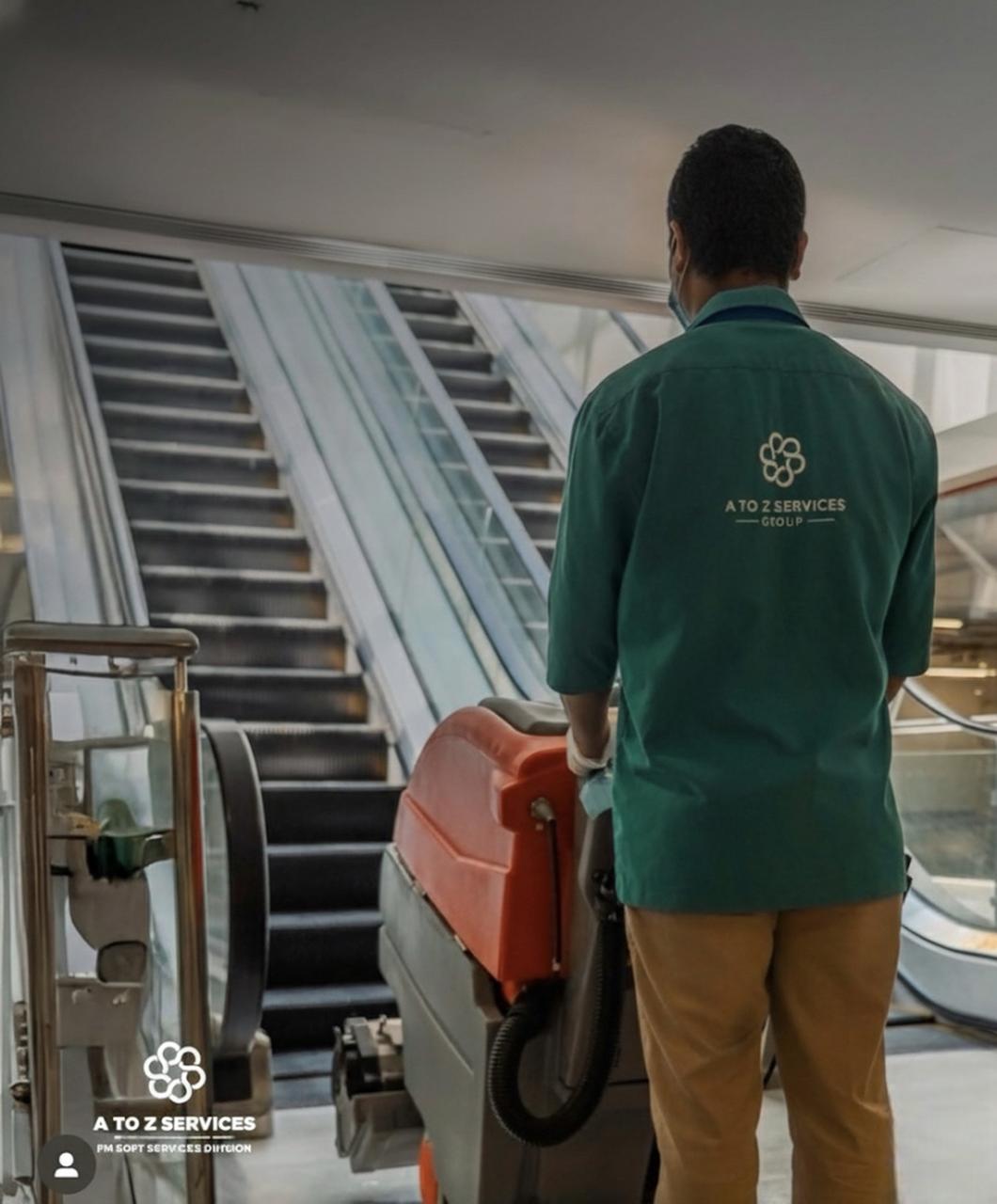 Technician performing surface disinfection